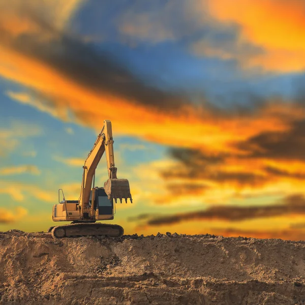 Excavator at sunrise